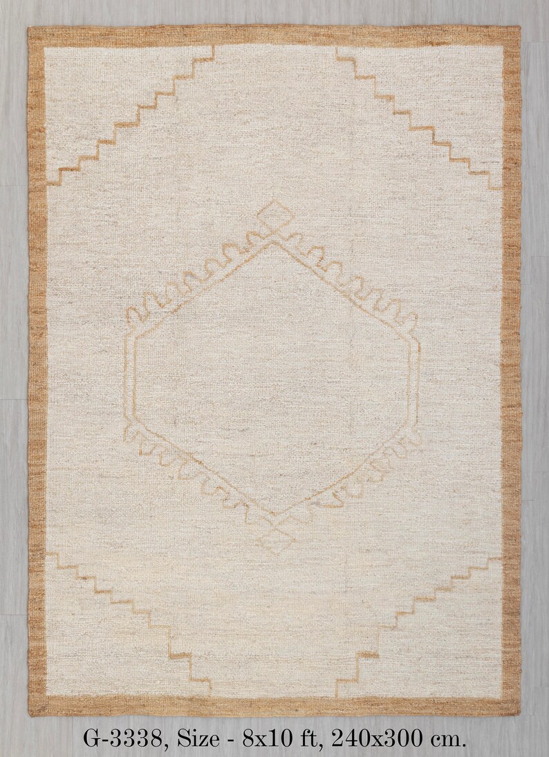 May include: A beige and brown rug with a geometric pattern. The rug is 8x10 feet, or 240x300 centimeters.