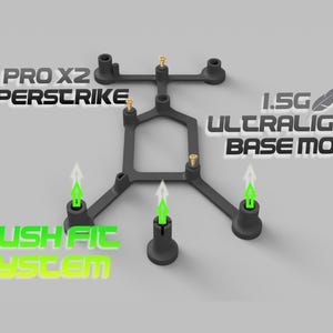 May include: A black, H-shaped structural component featuring a push-fit system with three green arrow icons, four small gold screws, and text reading PRO X2 SUPERSTRIKE and 1.5G ULTRALIGHT BASE MOD with a feather graphic.