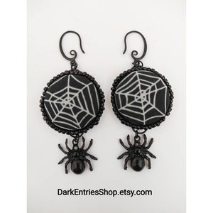 White spider web earrings