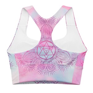 Goddess Swag Soul Star Chakra Mandala Racerback Sports Bra.  Background all over color is soft pastels of blues and pinks. the design on the front and back is the soul star with mandala in a deep pink.