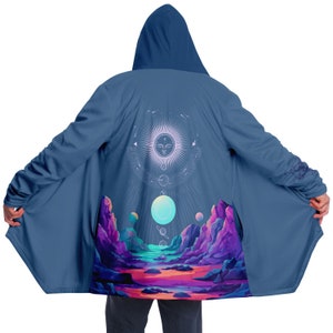 May include: A blue hooded cloak with a colorful, abstract design on the back. The design features a sun with a face, planets, and mountains.