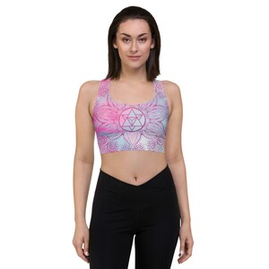 Goddess Swag Soul Star Chakra Mandala Racerback Sports Bra.  Background all over color is soft pastels of blues and pinks. the design on the front and back is the soul star with mandala in a deep pink.