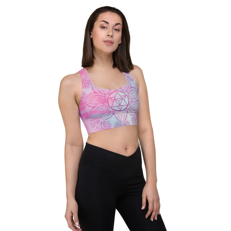 Goddess Swag Soul Star Chakra Mandala Racerback Sports Bra.  Background all over color is soft pastels of blues and pinks. the design on the front and back is the soul star with mandala in a deep pink.