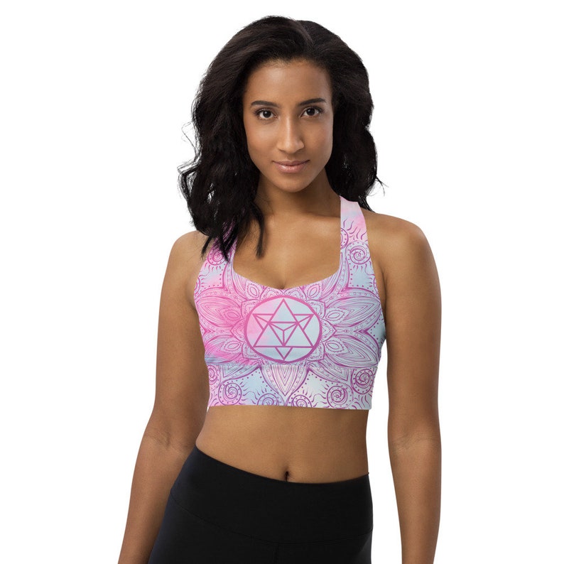 Goddess Swag Soul Star Chakra Mandala Racerback Sports Bra.  Background all over color is soft pastels of blues and pinks. the design on the front and back is the soul star with mandala in a deep pink.