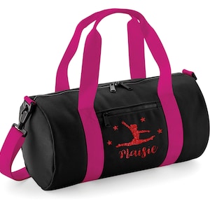 May include: Black gym bag with pink straps and a red glitter design of a gymnast with the name "Maisie" written below.