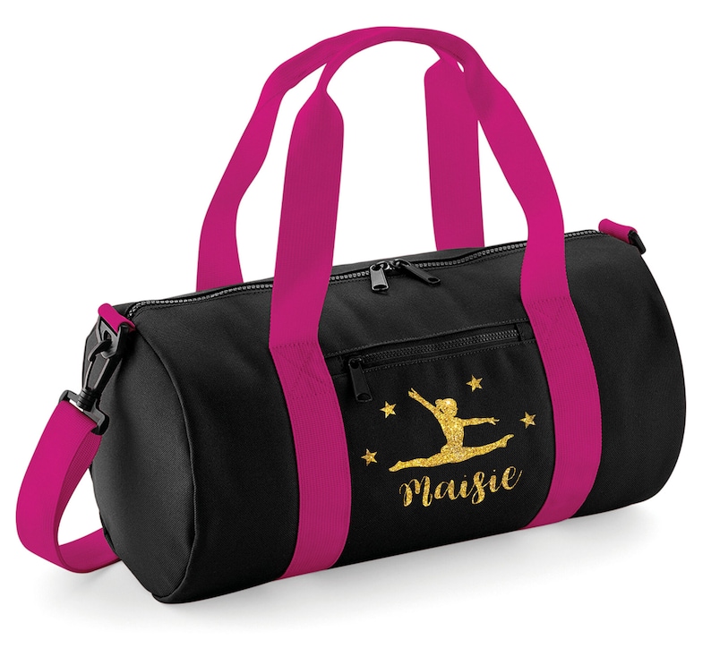 May include: Black gym bag with pink straps and a gold glitter design of a gymnast with the name Maisie.