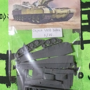 May include: A plastic model kit of a Soviet Object 490B Belka tank in 1/72 scale. The kit includes multiple pieces of gray plastic, including the tank's tracks, wheels, and body.