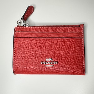 COACH schmale ID-Tasche aus orangefarbenem Crossgain-Leder