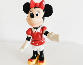 Figura vintage de Minnie Mouse con partes móviles, artículo de colección de Disney.