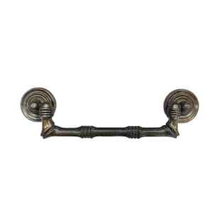 May include: Antique bronze-finished drawer pull with a decorative design. The pull features circular backplates and a horizontal bar with a bamboo-like texture. Ideal for adding a vintage touch to furniture.