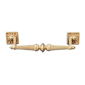 May include: A gold-colored drawer pull with a sunburst design on the square end pieces. The handle has a series of vertical lines and a central decorative element. This hardware is suitable for cabinets and furniture.