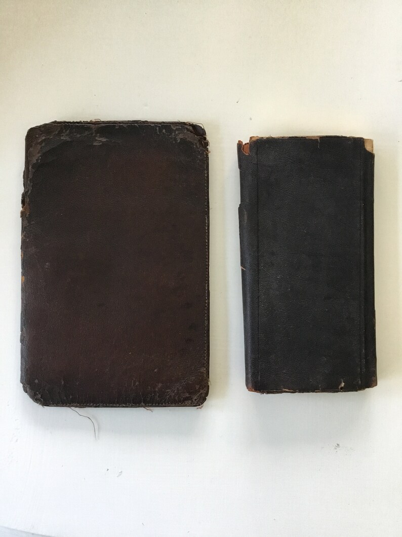 Two antique leather bound items; railroadsteamship wallet and a 1898 calendar diary.