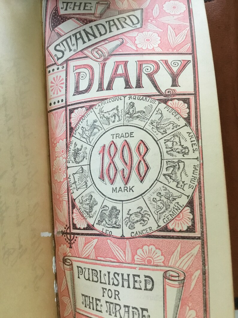 Two antique leather bound items; railroadsteamship wallet and a 1898 calendar diary.