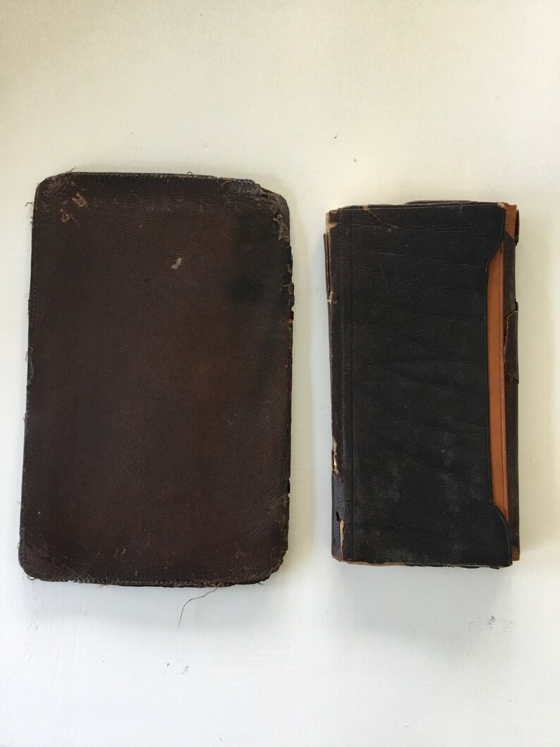Two antique leather bound items; railroadsteamship wallet and a 1898 calendar diary.