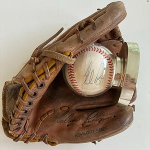Signed Nolan Ryan Spalding baseball glove and American League baseball