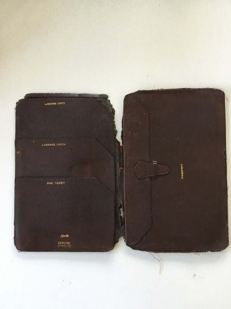 Two antique leather bound items; railroadsteamship wallet and a 1898 calendar diary.