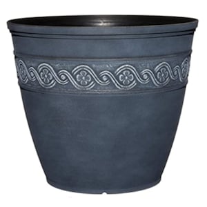 May include: A dark gray planter with a decorative white embossed design around the top. The planter has a rounded bottom and a wide opening.