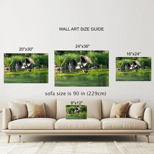 May include: A guide for choosing the right size wall art for your home. The guide shows different sizes of wall art with a sofa in the foreground. The text on the guide reads "Wall Art Size Guide" and includes the following sizes: 20"x30", 24"x36", 16"x24", and 8"x12". The text also reads "sofa size is 90 in (229cm)".