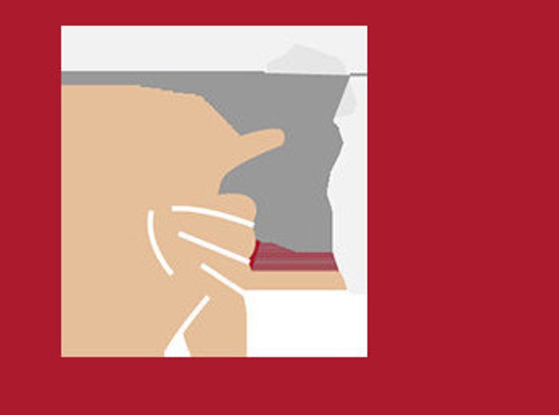 May include: A close-up of a hand holding a red and white striped fabric with a gray background.