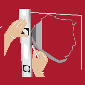May include: A person uses a level to ensure a straight line while drawing on a wall with a pencil.