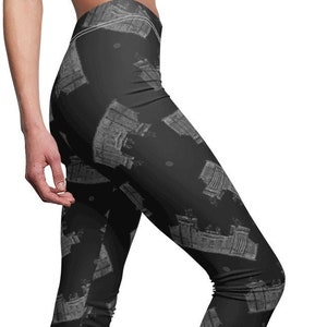 May include: Black leggings with a repeating pattern of a white building silhouette.
