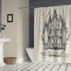 May include: A black and white illustration of a large pipe organ in a church. The organ is very detailed and intricate, with many pipes and other parts. The text "Lübeck Jakobikirche" is at the bottom of the image.