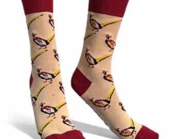 May include: A pair of beige socks with a red cuff. The socks feature a repeating pattern of colourful pheasants.
