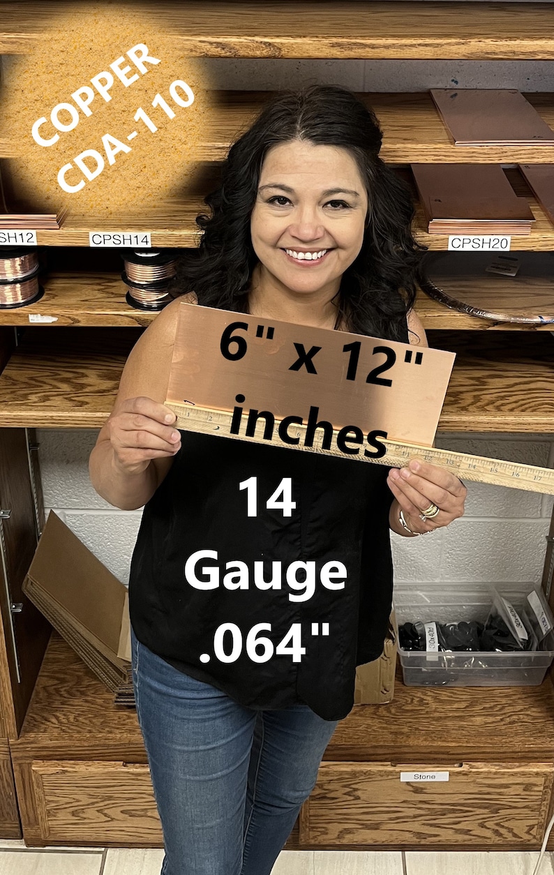 May include: A woman is holding a 6-inch by 12-inch sheet of copper. The copper sheet is 14 gauge and 0.064 inches thick. The text "COPPER CDA-110" is visible in the background.