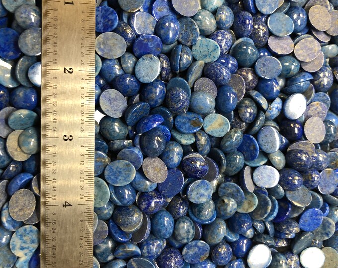 Lapis Lazuli 10x12mm Plus Minus Natural Denim Cabachon will fit in Bezel Cups - Product of Afganistan. Sold by the each.