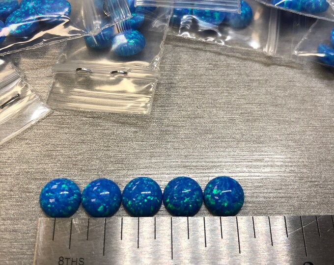 Synthetic Imitation 8mm Round Opal from Kyocera 5A Pacific Blue "Name Brand" compaired to other Lab Grown Opal