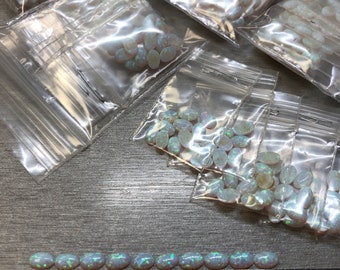 Synthetic Imitation 5x7mm Oval Opal from Kyocera 17 "Name Brand" compaired to other Lab Grown Opal