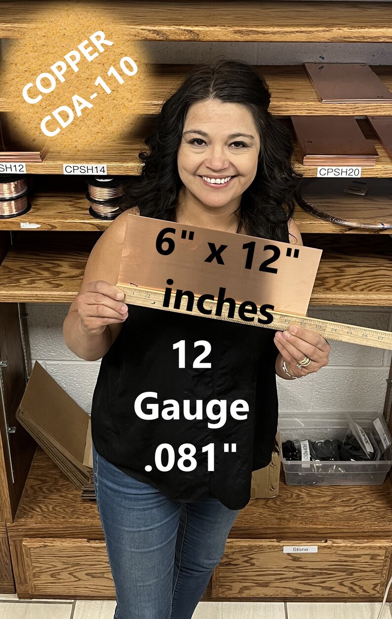 May include: A woman is holding a 6 by 12 inch sheet of copper, labelled "COPPER CDA-110 12 Gauge .081" inches. The copper sheet is on a wooden shelf with other copper sheets and rolls of copper wire.