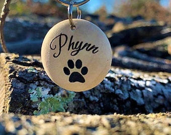 Varnished wooden dog identification tag | paw pattern