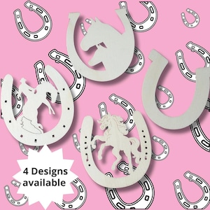 May include: Four wooden horseshoe designs with different cutouts. The designs include a horse, a unicorn, a cowboy riding a horse, and a plain horseshoe. The background is pink with a white starburst and the text "4 Designs available".