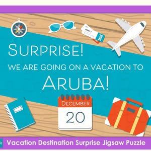 May include: A blue and white jigsaw puzzle with a wooden background. The puzzle shows a plane, sunglasses, a compass, a suitcase, and a calendar with the date December 20th. The text on the puzzle says "Surprise! We are going on a vacation to Aruba!"