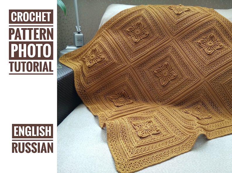 May include: A golden-brown crocheted blanket with a floral pattern. The blanket is draped over a sofa, showcasing the intricate details of the handmade design. The text "CROCHET PATTERN PHOTO TUTORIAL" is visible in the image.