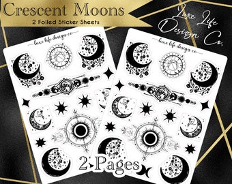 May include: Two white sticker sheets featuring black ink illustrations of crescent moons, dreamcatchers, celestial charts, and stars. The text reads Crescent Moons, 2 Foiled Sticker Sheets, Luxe Life Design Co., and 2 Pages. The designs are detailed.