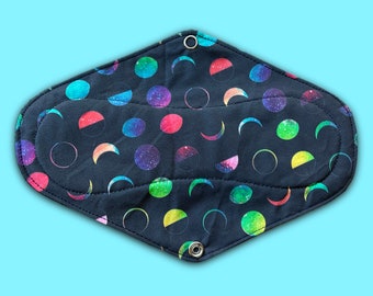 9.5" Rainbow Moons Cloth Pad. Handmade + Designed in Australia. Crafted With Soft + Natural 100% Cotton Fabrics. Black Backing