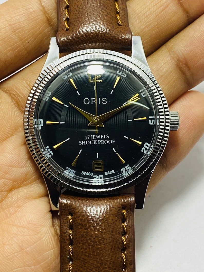 Rare vintage ORIS cadran noir montre-bracelet à remontage manuel pour homme mouvement FHF ST-96 suisse image 1