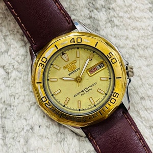 Vintage Seiko 5 Sports 100m Automatic Golden Dial With Transparent Caseback Date/Day Men's Japan Made Wrist Watch~ Japan Made~ Gift for him