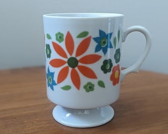 Vintage 1970s pedestal coffee mug | 70s floral tea cup | white orange brown avocado green blue | retro drinkware flowers gift