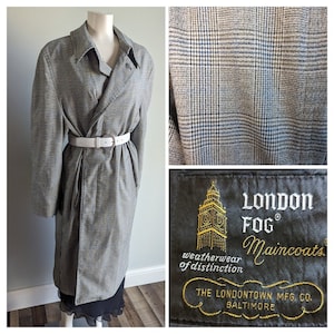 May include: A gray and black plaid London Fog Maincoats overcoat with a white belt. The label reads "London Fog weatherwear of distinction The Londontown Mfg. Co. Baltimore".