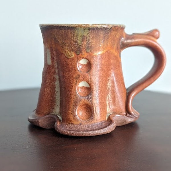 Handmade ceramic coffee mug | Artisanal pottery | Unique shape tea cup | brown white and green with thumb holder | 2010 12 fluid ounces