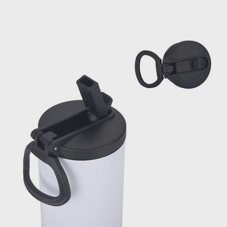 May include: A white water bottle with a black lid and handle. The lid is open, revealing the drinking spout. A separate black lid is also shown. The bottle is designed for easy carrying and use.