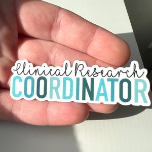 May include: A sticker with the text "Clinical Research Coordinator" in a gradient of blue and teal colors.