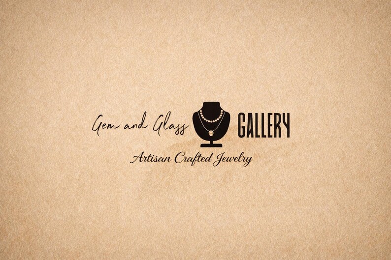 May include: Logo for Gem and Glass Gallery, featuring a black silhouette of a necklace on a bust, with the words "Gem and Glass GALLERY" and "Artisan Crafted Jewelry" in elegant script on a tan background.