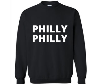 May include: Black sweatshirt with the text "PHILLY PHILLY" printed in white on the front.