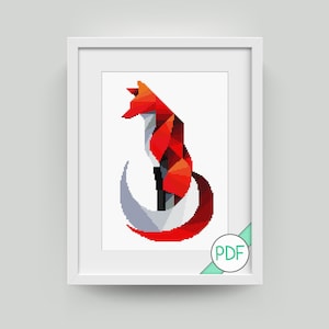 Puede incluir: Un patrón de punto de cruz de zorro geométrico en rojo, naranja, blanco y negro. El zorro está sentado con la cola enroscada alrededor de su cuerpo. El patrón está en un marco blanco con una etiqueta PDF en la esquina.