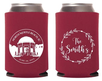 May include: Two burgundy can coolers. One features a white illustration of a gazebo with the text "North Myrtle Beach, SC" and "June 29, 2023". The other has a white floral wreath with "The Smith's" in the center.