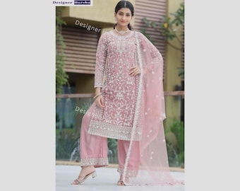 May include: A dusty rose three-piece ensemble featuring a long-sleeved tunic with intricate white floral embroidery, matching wide-leg trousers with embroidered hems, and a sheer, lightweight dupatta with a delicate white border and floral motifs.